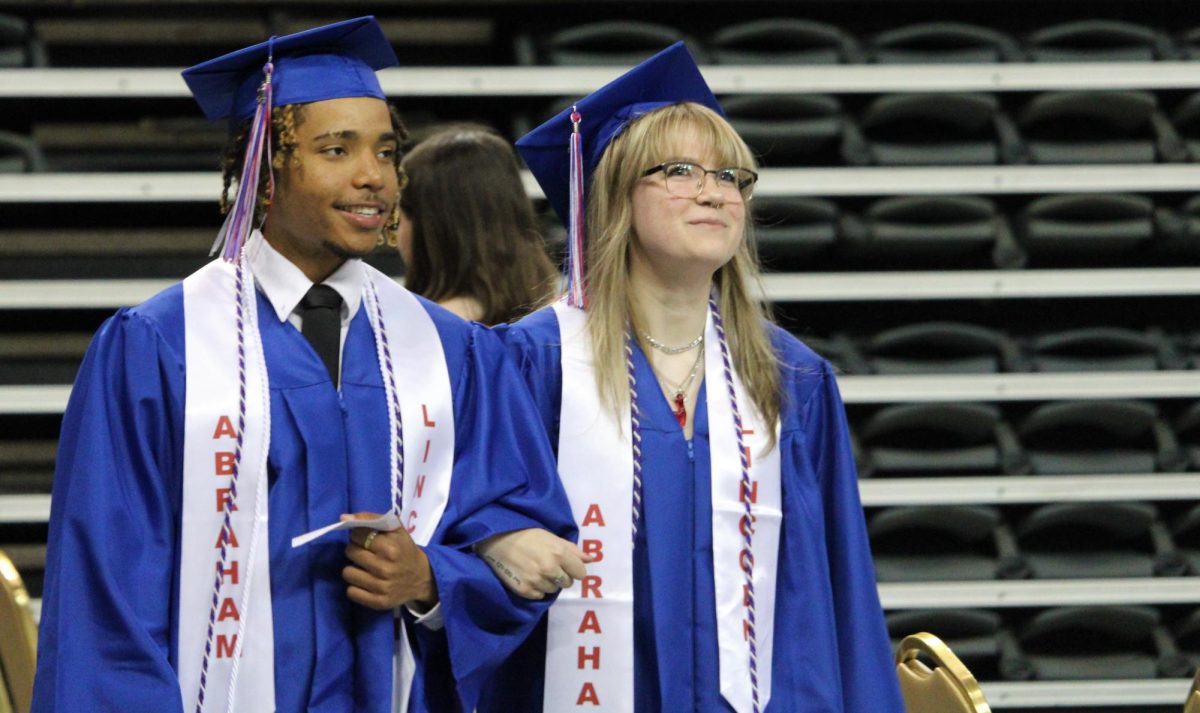 Javareon Henderson and Taylor Henderson enter the staging area for graduation.